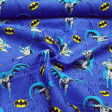 Cotton Batman Comic Background fabric - Licensed cotton fabric with drawings of the Batman character and logos on a bluish background with comic motifs. The fabric is 110cm wide and its composition is 100% cotton.