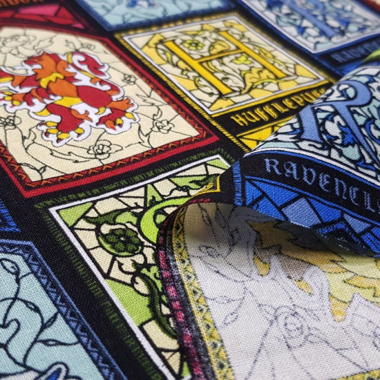 Cotton Harry Potter Stained Glass fabric - Licensed cotton fabric with colorful stained glass drawings representing the different Hogwarts houses from the Harry Potter saga. The fabric is 110cm wide and its composition is 100% cotton.