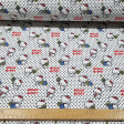 Cotton Hello Kitty Tennis Dots fabric - Beautiful licensed cotton fabric with drawings of Hello Kitty the cat with tennis rackets on a white background with black polka dots. The fabric is 150cm wide and its composition is 100% cotton.