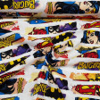 Tela Algodón Heroinas DC Cómic Logos - Tela de algodón licencia ancho americano con dibujos de las superheroínas de comics DC y logotipos de Wonder Woman, Catgirl y Supergirl. La tela mide 110cm de ancho y su composición 100% algod&oa