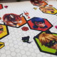 Cotton Ladybug Kwamis fabric - Licensed cotton poplin fabric with drawings of the characters from the animated series Miraculous Ladybug in which the characters Ladybug, Cat Noir, Red Fox and Queen Bee and also their Kwamis appear on a geometric backg