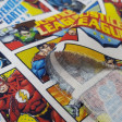 Cotton Justice League Comic fabric - Licensed cotton fabric with drawings of comic strips with the characters of the Justice League from DC Comics. The fabric measures between 140-150cm wide and its composition is 100% cotton.