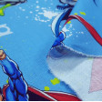 Tela Algodón Liga de la Justicia Decorativo - Tela de algodón licencia ideal uso decorativo con los personajes de Batman, Superman, Flash y Linterna Verde sobre un fondo de color azul. La tela mide 140cm de ancho y su composición 100% algodón.  