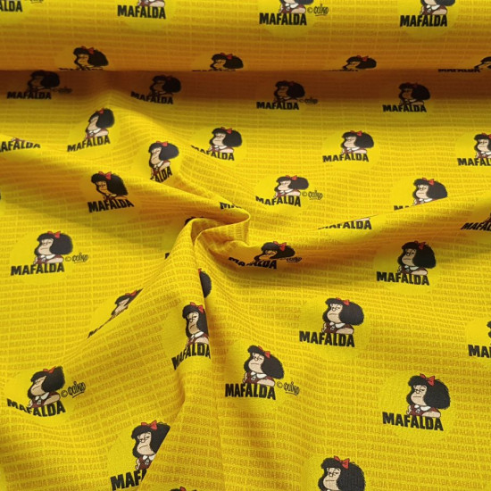 Cotton Mafalda Yellow fabric - Organic cotton fabric with drawings of the Mafalda character on a background with the name in a mustard yellow tone. The fabric is 150cm wide and its composition is 100% cotton.