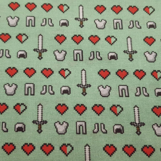 Cotton Minecraft Symbols Emojis fabric - Licensed cotton fabric with drawings of symbols and emojis from the Minecraft video game on a green background. The fabric is 110cm wide and its composition is 100% cotton.