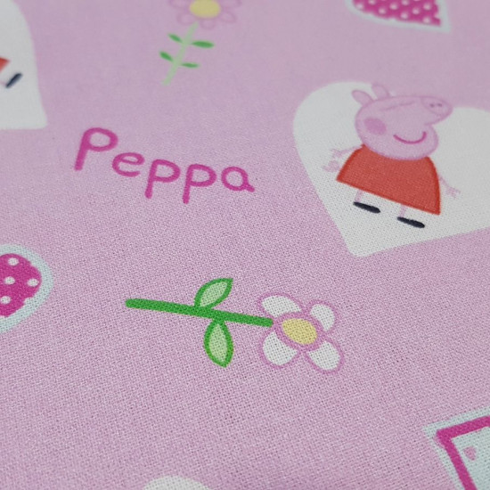 Cotton Peppa Pig Hearts fabric - Licensed cotton fabric with drawings of the Peppa Pig character inside white hearts on a pink background with flowers and hearts. The fabric measures between 140-150cm wide and its composition is 100% cotton.