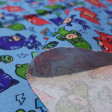 Cotton PJ Masks Rays fabric - Licensed cotton poplin fabric with drawings of the PJ Masks animation characters on a blue background with rays and masks. The fabric measures 140cm wide and its composition is 100% cotton.