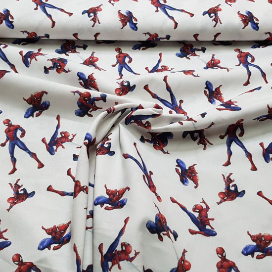 Cotton Spiderman Poses fabric - Marvel licensed cotton fabric with drawings of the Spiderman character in various poses on a white background. The fabric measures 150cm wide and its composition is 100% cotton.