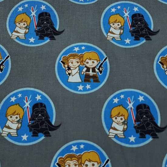 Cotton Star Wars Duo Kawaii fabric - Licensed cotton fabric with drawings of Star Wars characters couples in Kawaii style in blue spheres on a gray background. The fabric is 110cm wide and its composition is 100% cotton.