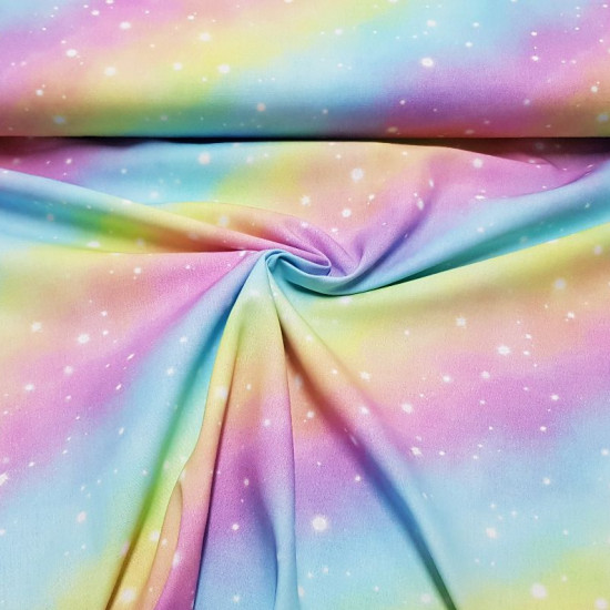 Cotton Rainbow Galaxy Digital fabric - Digital printing cotton fabric with drawings of rainbows and stars simulating the galaxy. A beautiful and colorful fabric! The fabric is 150cm wide and its composition is 100% cotton.