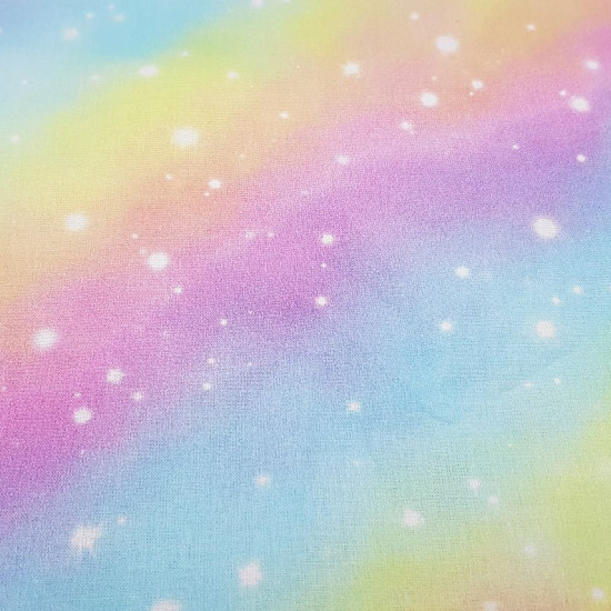 Cotton Rainbow Galaxy Digital fabric - Digital printing cotton fabric with drawings of rainbows and stars simulating the galaxy. A beautiful and colorful fabric! The fabric is 150cm wide and its composition is 100% cotton.