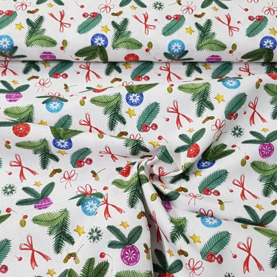 Cotton Christmas Decoration Bows fabric - Organic cotton fabric with Christmas drawings of fir branches, with decorations such as bows, stars, colored balls... The fabric is 150cm wide and its composition is 100% cotton.