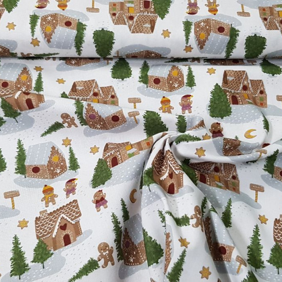 Cotton Christmas Gingerbread Houses fabric - Organic cotton fabric with Christmas drawings where gingerbread houses appear in a forest with snow and fir trees, where there are also funny gingerbread figures. The fabric is 150cm wide and its composition is