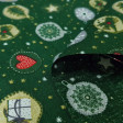 Cotton Christmas Balls Ornaments Stars Green fabric - Cotton poplin fabric with patterns of balls with ornaments in green, red and gold tones, on a green background with stars. The fabric is 140cm wide and its composition is 100% cotton.