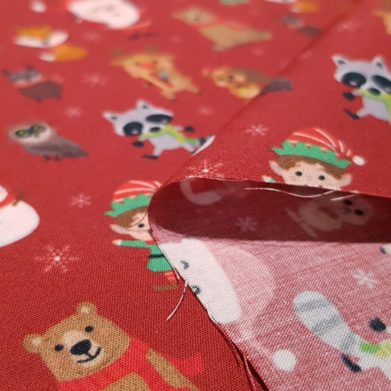 Cotton Christmas Santa Claus Animals fabric - Christmas cotton poplin fabric with very funny drawings where Santa Claus appears with elfs, reindeer and other forest animals on a background of snowflakes in two shades of color to choose from. The fabric is