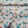 Cotton Christmas Dinosaurs fabric - Very funny cotton poplin fabric with drawings of dinosaurs at Christmas. Tyrannosaurs appear with Christmas sweaters, diplodocus with lights around their necks, volcanoes, snowmen... We can find this fabric in two backg