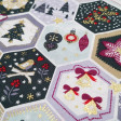 Cotton Christmas Hexagonal Panels fabric - Christmas cotton poplin fabric with panel drawings in hexagonal shapes with different Christmas motifs such as reindeer, stars, Christmas trees... The fabric is 140cm wide and its composition is 100% cotton.