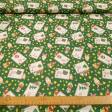 Cotton Christmas Three Wise Men Letters fabric - Cotton poplin fabric with Christmas drawings of the Three Wise Men, on a green background with letters for the Three Wise Men, objects such as crowns and stars... The fabric is 150cm wide and its compositio