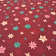 Cotton Christmas Stars Wishes fabric - Cotton poplin fabric with Christmas star designs in different shapes and colors on a red/maroon background. The fabric is 150 cm wide and is made of 100% cotton.