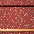 Cotton Christmas Stars Wishes fabric - Cotton poplin fabric with Christmas star designs in different shapes and colors on a red/maroon background. The fabric is 150 cm wide and is made of 100% cotton.