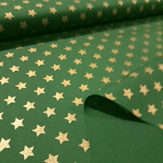Cotton Christmas Golden Stars fabric Cotton Christmas Golden Stars fabric - Christmas cotton fabric with drawings of golden stars on various backgrounds to choose from. A fabric that can be combined with other colors and create a warm atmosphere for Christmas. The composition of the fabric i