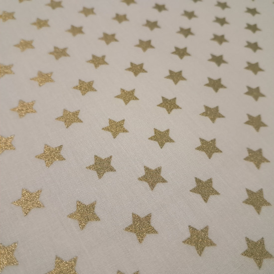 Cotton Christmas Golden Stars fabric Cotton Christmas Golden Stars fabric - Christmas cotton fabric with drawings of golden stars on various backgrounds to choose from. A fabric that can be combined with other colors and create a warm atmosphere for Christmas. The composition of the fabric i