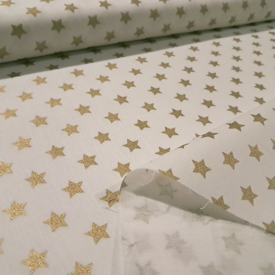 Cotton Christmas Golden Stars fabric Cotton Christmas Golden Stars fabric - Christmas cotton fabric with drawings of golden stars on various backgrounds to choose from. A fabric that can be combined with other colors and create a warm atmosphere for Christmas. The composition of the fabric i
