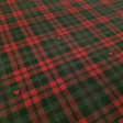 Cotton Scottish Check Jackson fabric - Organic cotton poplin fabric with a Scottish check pattern with small red hearts. The fabric measures 145cm wide and its composition is 100% cotton.
