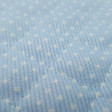 Quilted Pique White Polka Dot Light Blue Background fabric - Light blue quilted piqué fabric with small white dots. Ideal fabric for children's projects and especially baby accessories such as bags, changing tables, diaper envelopes ... The fabric is 150c