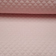 Quilted Pique White Polka Dot Pink Background fabric - Pink quilted piqué fabric with small white dots. Ideal fabric for children's projects and especially baby accessories such as bags, changing tables, diaper envelopes ... The fabric is 150cm wide and i