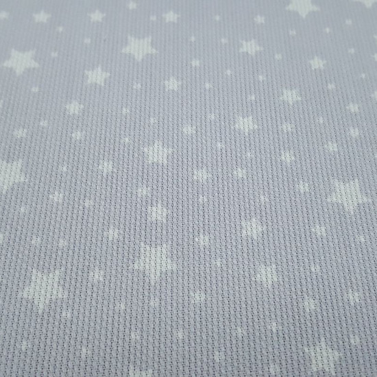 Piqué Stars Arturo fabric - Children's cotton piqué fabric with patterned white stars of various sizes on a gray background. The fabric is 150cm wide and its composition is 100% cotton.