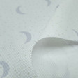 Piqué Half Moon Dots Gray fabric - Children's cotton pique fabric with gray crescent moons with light dots on a white background. The fabric is 150cm wide and its composition is 100% cotton.