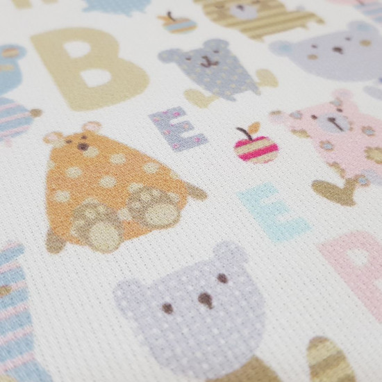 Pique Bears Letters Patchwork fabric - Children's themed cotton pique fabric with drawings of colored bears with patchwork drawings and letters where the words 'bear' appear The fabric is 150cm wide and its composition is 100% cotton.
