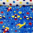 Coral Fleece Double Sided Aircraft fabric - Very funny double-sided coral fleece fabric, that is to say, a drawing for each side of the fabric. On this fabric there are drawings of planes, helicopters, stars and polka dots on a blue background. On the oth