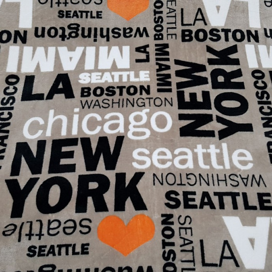 Coral Fleece Love USA fabric - Very soft and warm coral fleece fabric with letters from several cities in the United States (New York, Miami, Chicago, Washington ...) in black and white colors in different sizes and also drawings of orange hearts. All