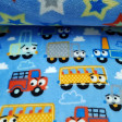 Coral Fleece Double Sided Cars and Stars fabric - Double-sided coral fleece fabric (a different drawing on each side) of children's theme. On one side there are drawings of cars, trucks and colored buses on a blue background with clouds and on the other s