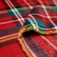 Fleece Coral Scottish Tartan fabric - Soft and warm coral fleece fabric with the classic Scottish tartan pattern. The fabric is 150cm wide and its composition 100% polyester.