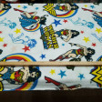 Poly Fleece Wonder Woman fabric - DC Comics licensed poly fleece fabric with Wonder Woman drawings on a white background with colored stars. This fabric is ideal for making blankets and large projects. The fabric measures 145cm wide and its 100% poly
