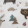 Coral Fleece Alpine Forest fabric - Coral fleece fabric with drawings of animals such as reindeer, deer, hedgehogs, bears... on a white background with trees, plants and mushrooms. The fabric is 150cm wide and its composition is 100% polyester.