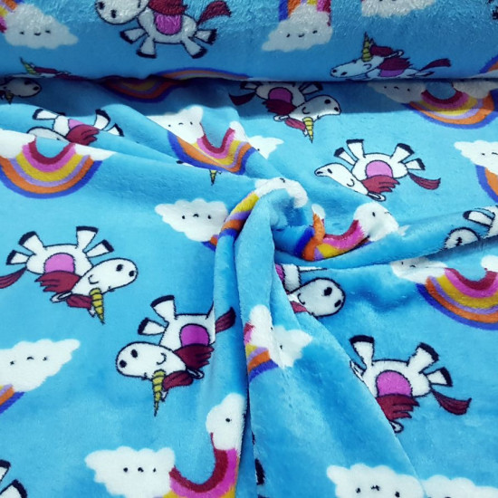 Coral Fleece Rainbow Unicorns fabric - Coral fleece fabric with children's drawings of unicorns and rainbows on a turquoise blue background. The fabric is 150cm wide and its composition is 100% polyester.