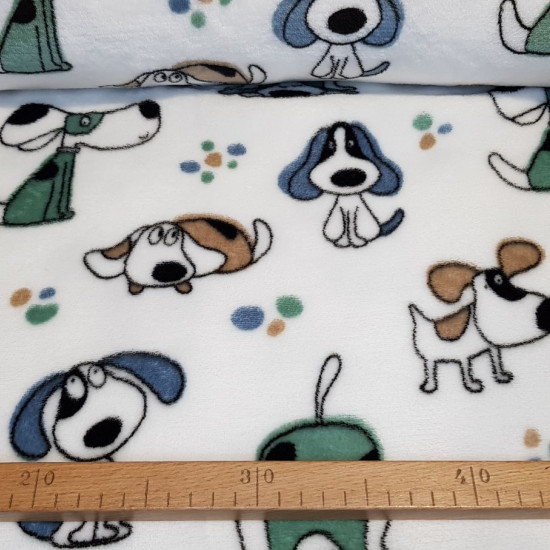 Coral Fleece Puppies fabric - Very soft and warm coral fleece fabric with drawings of dogs on a white background. The fabric is 150cm wide and its composition is 100% polyester.
