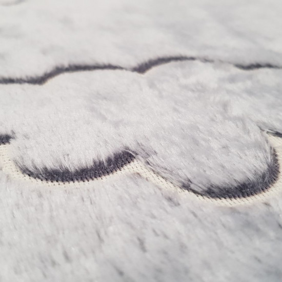 Coral Fleece Neon Clouds fabric - Coral fleece fabric with very soft fur, with embossed cloud designs whose silhouette glows in the dark. The fabric has to be 