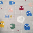 Coral Fleece Pac-man fabric - Coral fleece fabric with a very warm and soft touch with very funny drawings of the classic Pac-Man video game on a gray background. The fabric is 150cm wide and its composition is 100% polyester.