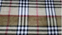 Coral Fleece Scottish Check Beige fabric - Coral fleece fabric with a Burberry-style Scottish check pattern, in beige and brown tones. Ideal for blanket and other confections. The fabric is 150cm wide and its composition is 100% polyester.