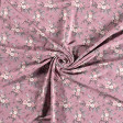 Jersey Bouquets Old Pink fabric - Jersey fabric with drawings of bouquets of roses on an old pink background. The fabric is 150cm wide and its composition is 95% cotton - 5% elastane.