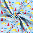 Cotton Jersey Submarines Lighthouses fabric - Cotton jersey fabric digital printing with drawings of yellow submarines, lighthouses, anchors and fish on a light blue background. The fabric is 150cm wide and its composition is 95% cotton - 5% elastane.