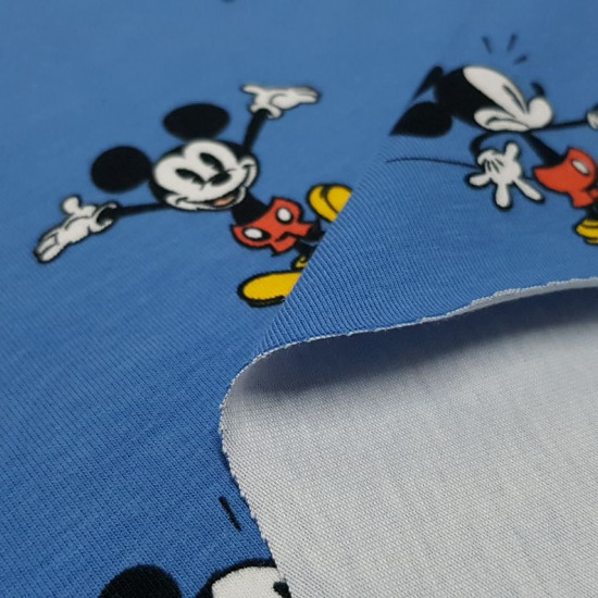 Cotton Jersey Disney Mickey Blue fabric - Children's themed cotton knit fabric, in which Disney's Mickey Mouse character appears doing various funny poses on a blue background. The fabric is 150cm wide and its composition 95% cotton - 5% elastane