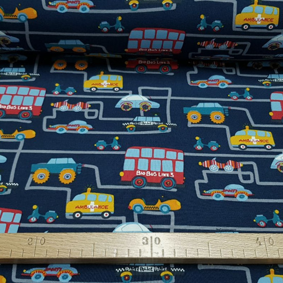 Cotton Jersey Traffic City Blue fabric - Cotton jersey fabric with drawings of cars, buses, police cars, firecars... on gray lines simulating the traffic of a city on a dark blue background. The fabric measures 150cm wide and its composition 95% cotton - 