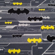 Cotton Jersey Batman Logos fabric - Licensed cotton jersey fabric with drawings of Batman logos in various colors and sizes on a background where gray colors predominate. The fabric is 150cm wide and its composition is 92% aglodon - 8% elastane.