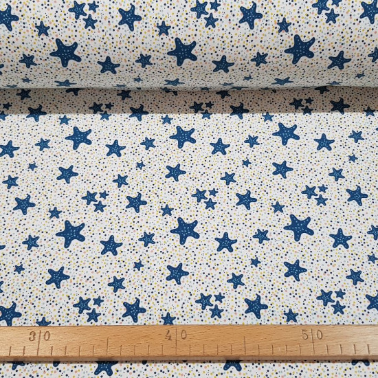 Cotton Jersey Starfish fabric - Organic cotton jersey fabric with blue starfish drawings on a white background with colorful polka dots. The fabric is 150cm wide and its composition is 95% cotton - 5% elastane.